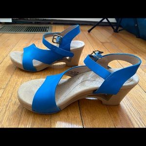 Bright blue Dansko Tasha sandals with heel